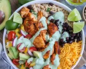 Delicious chicken taco cheese bowl topped with cheddar cheese, avocado, and corn.
