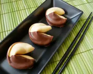 Chocolate-Dipped Fortune Cookies with customizable fortunes and rich chocolate.