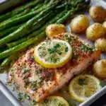 Delicious lemon garlic butter salmon served on a plate with garnishes.