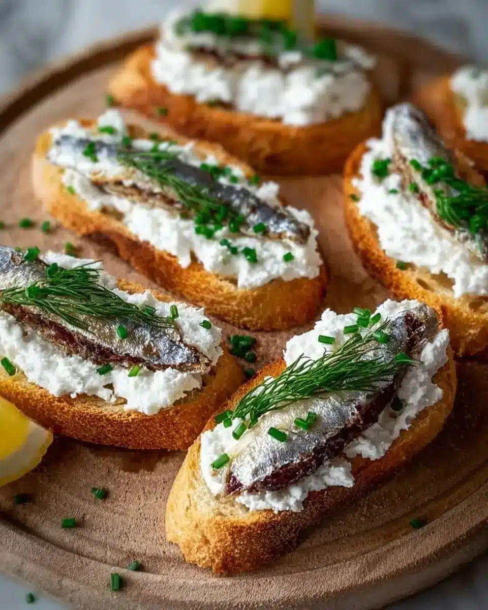 Sardine Goat Cheese Crostini served on a platter as an elegant appetizer.