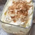 Homemade banana pudding showcasing layers of bananas, cream, and vanilla wafers.