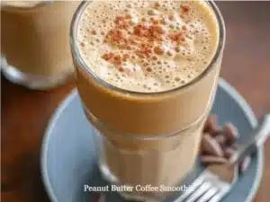 Peanut Butter Coffee Smoothie 5 Delicious Peanut Butter Coffee Smoothie in a glass with coffee beans and peanuts