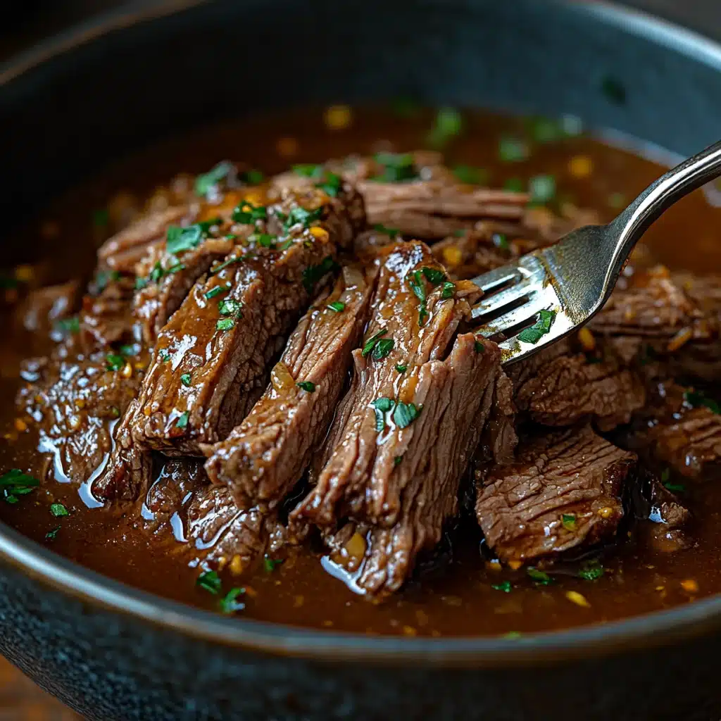 Close-up of tender shredded pot roast beef with glistening gravy