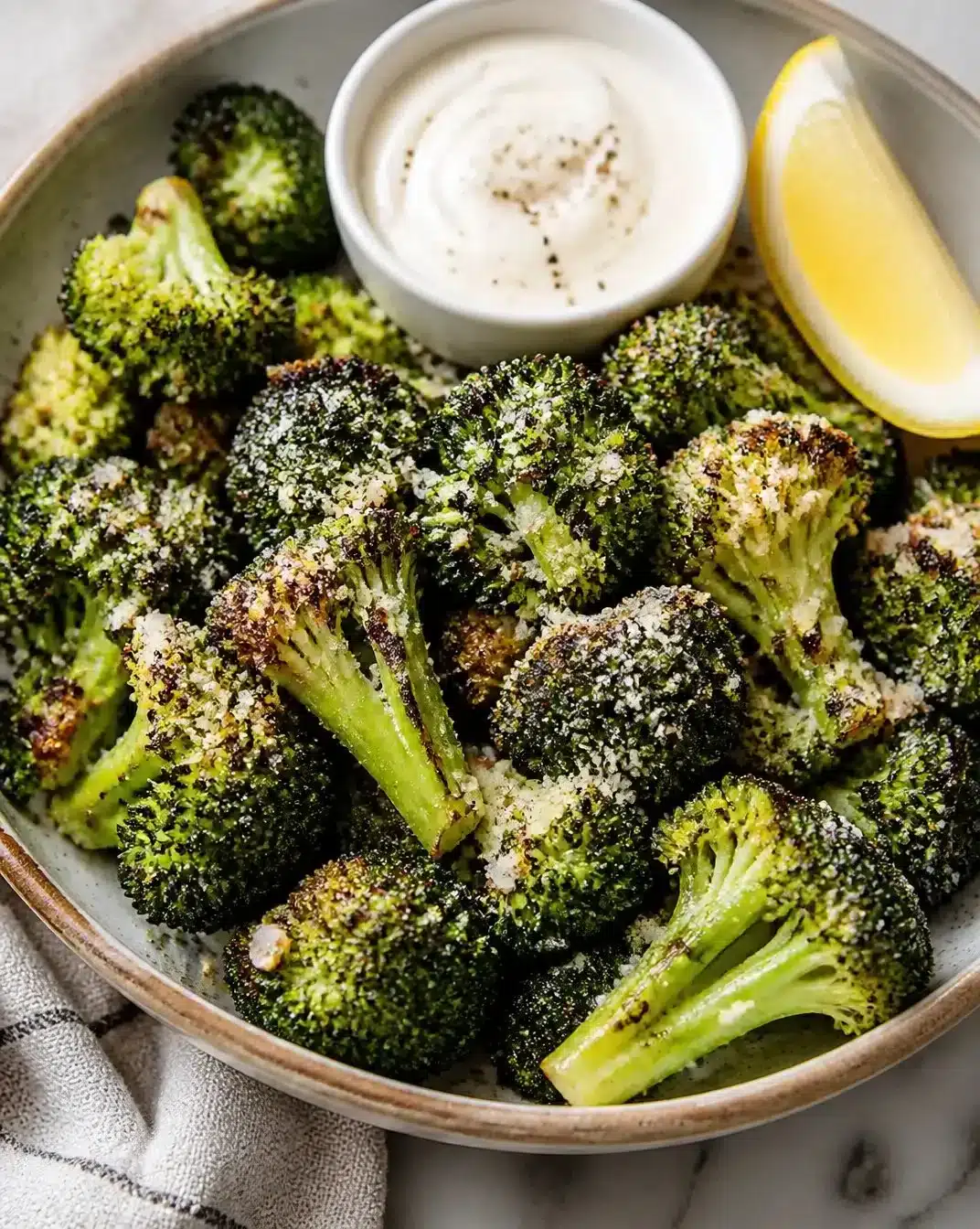 Crispy Air Fryer Broccoli topped with Garlic and Parmesan cheese