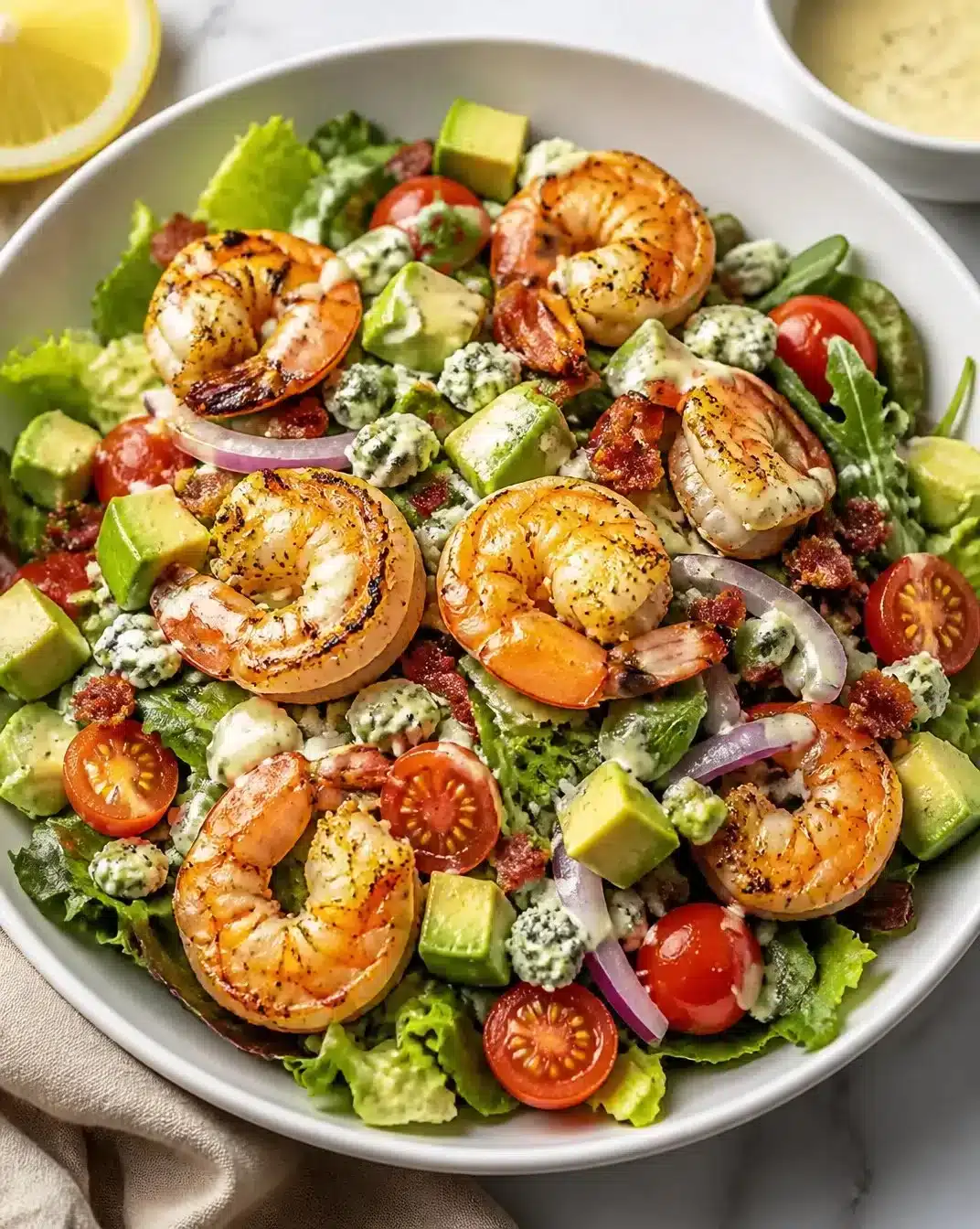 Charred Shrimp Cobb Salad with Avocado 1 Charred Shrimp Cobb Salad with Avocado, featuring fresh vegetables and grilled shrimp.