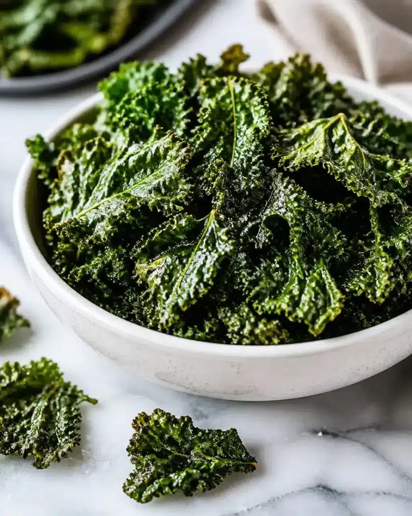 Bowl of crispy air fryer kale chips garnished with spices