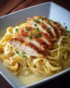 Delicious crispy chicken on creamy pasta, a perfect comfort food dish