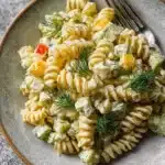 Delicious Dill Pickle Pasta Salad with a zesty twist served in a bowl.