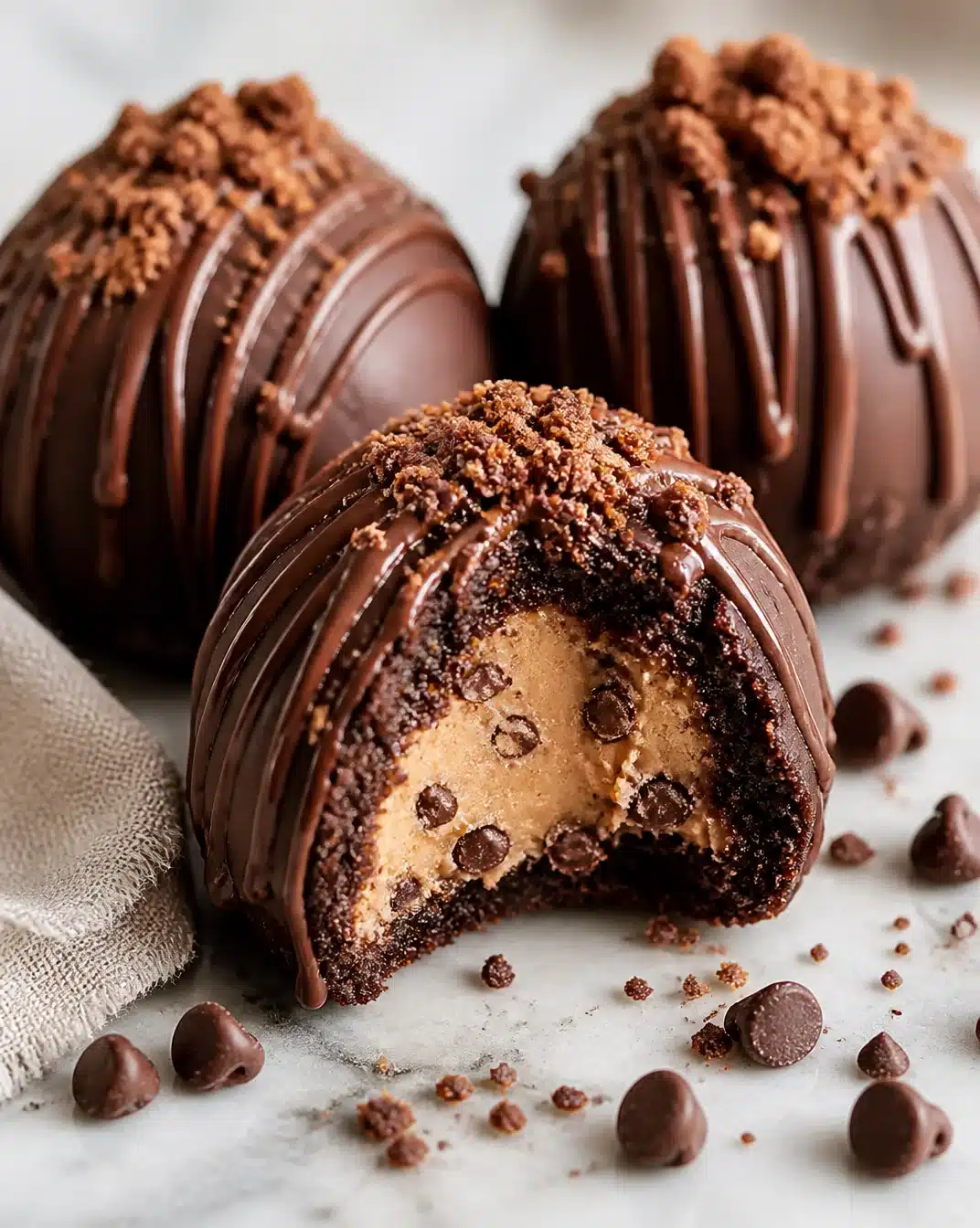 Fudgy brownie bombs with cookie dough filling on a plate