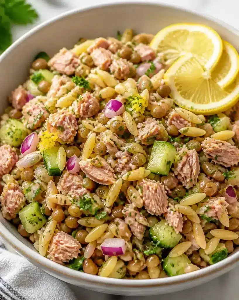Lemon-Tuna Lentil Orzo Salad with Zest served in a bowl