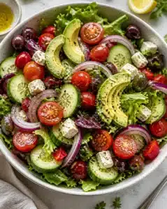 Delicious summer salad featuring fresh vegetables and vibrant herbs.